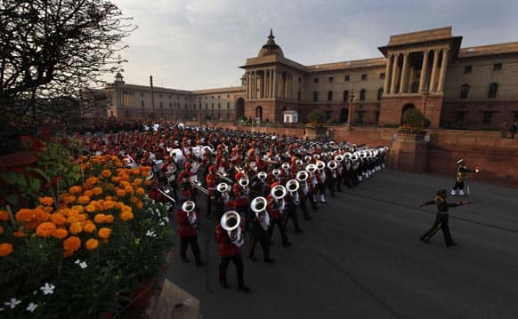 Military band from the three forces march to perform during full dress rehearsals of the Beating Retreat ceremony at Raisina hill which houses India`s most important ministries and presidential palace, in New Delhi.