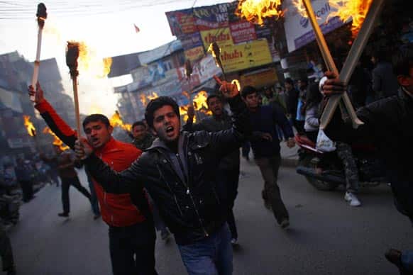 Activists of Nepali Congress party affiliated Nepal Student Union stage a torch rally through the streets against Prime Minister Baburam Bhattarai in Katmandu.