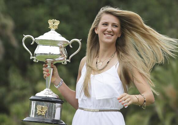 Victoria Azarenka of Belarus poses with the Australian Open trophy in the Royal Botanical Gardens following her win over China`s Li Na in the women`s final, in Melbourne.