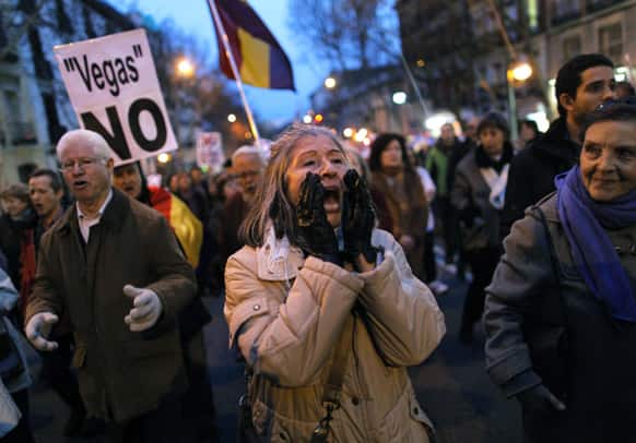 Protestors carry a banner reading `Vegas No` as they shout slogans during a protest against the Eurovegas project in Madrid, Spain.