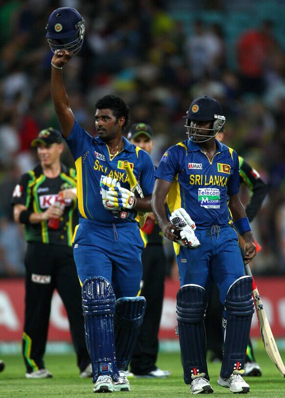 Sri Lanka`s Angelo Mathews and Thisara Perera celebrate their win over Australia in their Twenty/20 international cricket match in Sydney, Australia.