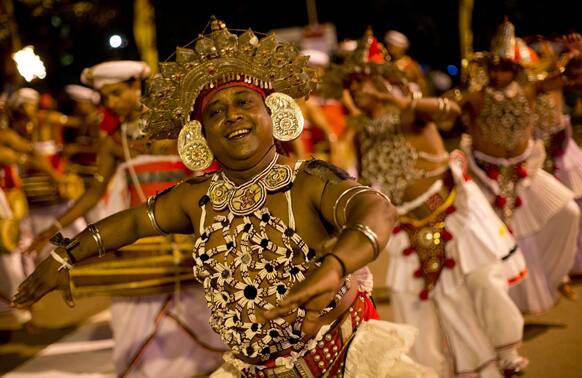 Traditional dancers perform during an annual Buddhist procession in Kelaniya, suburbs of Colombo.