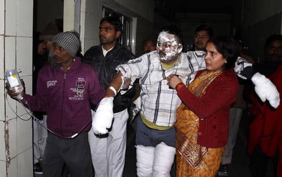A devotee is treated at a hospital after receiving burn injuries when a tent erected to house Hindu holy men visiting the Maha Kumbh festival caught fire in Allahabad.