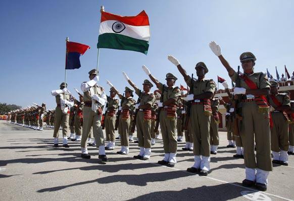 Female Indian Border Security Force (BSF) officer, right in front row, takes oath with her male colleagues during their passing out ceremony in Bangalore.