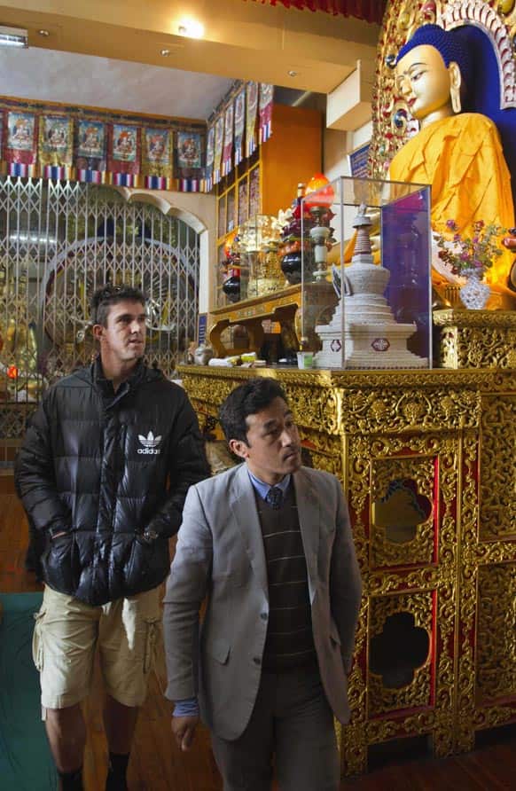 England’s Kevin Pietersen, left, visits the Namgyal Monastery, a Tibetan Buddhist temple, in Dharmsala.