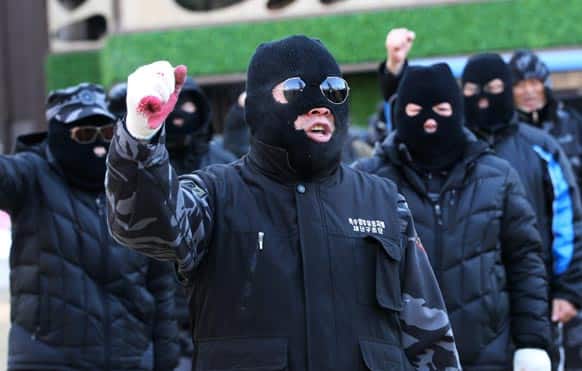 Former soldiers of South Korean`s Headquarters of Intelligence Detachment (HID) shout a slogan during a rally against South Korean government giving support to pro-North Korean groups in South Korea near Seoul City Hall in Seoul, South Korea.