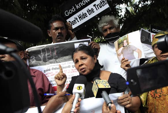 Sandya Ekneligoda, wife of missing journalist Prageeth Ekneligoda speaks to reporters during a protest rally out side the parliament in Colombo.