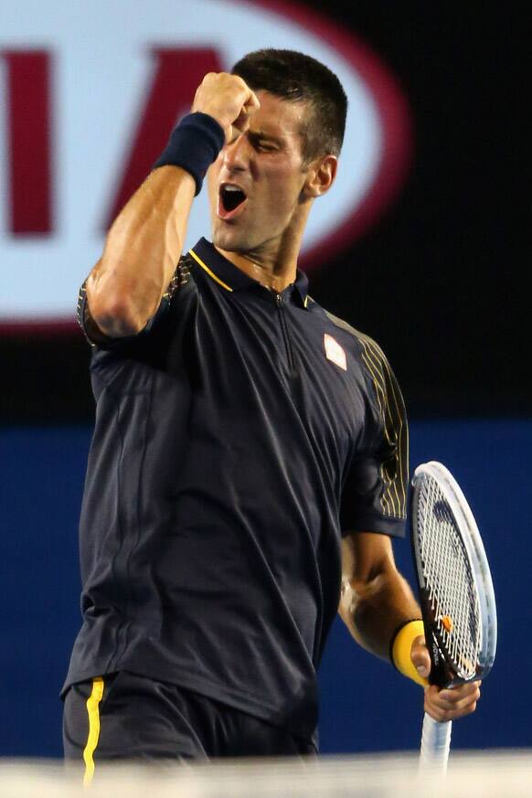 Serbia`s Novak Djokovic celebrates after winning his semifinal match against Spain`s David Ferrer at the Australian Open tennis championship in Melbourne.