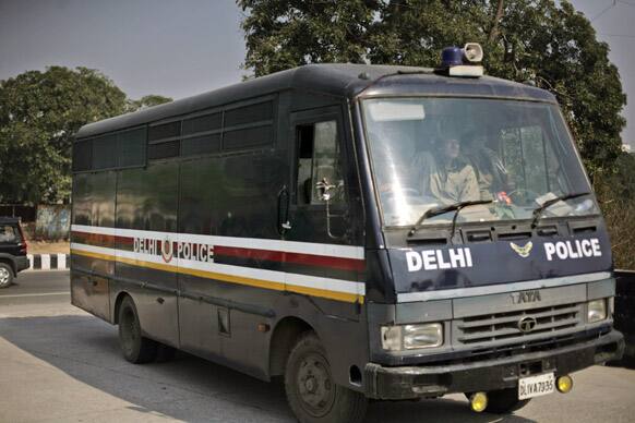 A Delhi police van, carrying the accused in a gang rape of a 23-year-old woman, enters a district court in New Delhi.