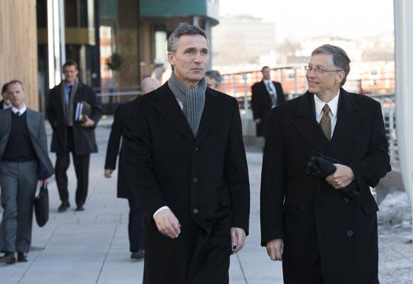 Norwegian Prime Minister Jens Stoltenberg, left, walks with Microsoft founder Bill Gates in Oslo. They met during a seminar which discusses challenges of international aid and health.
