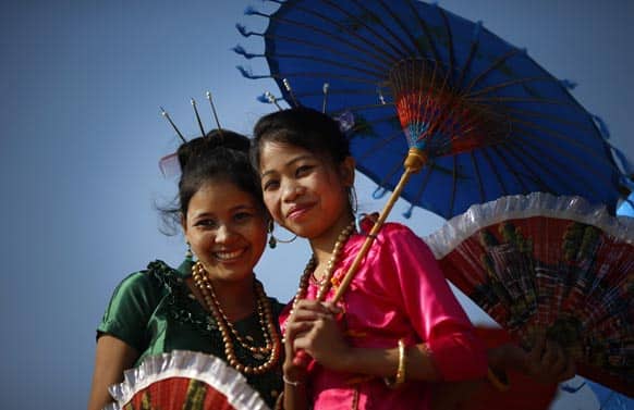 Women wearing traditional attire from the north eastern Indian state of Tripura perform on their state tableaux that will participate in the Republic Day parade, during a press preview in New Delhi.