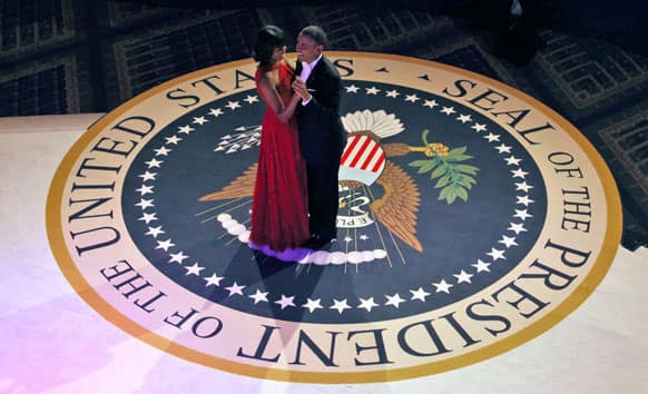 President Barack Obama and first lady Michelle Obama dance at the Commander-in-Chief`s Inaugural Ball in Washington, at the Washington Convention Center during the 57th Presidential Inauguration.