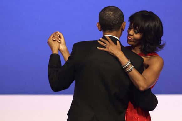 President Barack Obama and first lady Michelle Obama dance together at the Commander-in-Chief`s Inaugural Ball in Washington, at the Washington Convention Center during the 57th Presidential Inauguration.