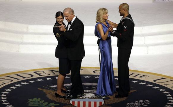 Vice President Joe Biden dances with Army Staff Sgt. Keesha Dentino as Jill Biden dances with Navy Petty Officer 3rd Class Patrick Figueroa during the Commander-In-Chief inaugural ball at the Washington Convention Center during the 57th Presidential Inauguration.