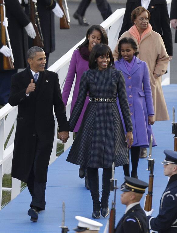 President Barack Obama, first lady Michelle Obama and Malia and Sasha Obama and Michelle Obama`s mother Marian Robinson walk down to the Presidential reviewing stand in front of the White House.