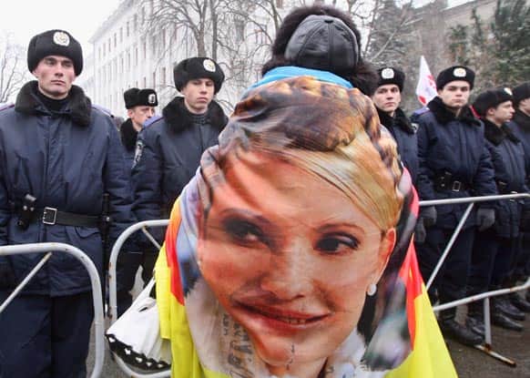 A supporter of former Ukrainian Prime Minister Yulia Tymoshenko take part in a rally outside Ukraine`s Presidential office in Kiev, Ukraine.