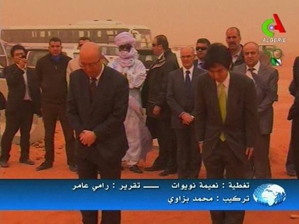 Japanese Parliamentary Vice Minister for Foreign Affairs Minoru Kiuchi, right, and Koichi Kawana, president of Japanese engineering firm JGC Corporation, bow towards the Ain Amenas gas facility a day after special forces stormed the plant to end a four-day siege, in Algeri.