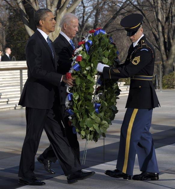 President Barack Obama and Vice President Joe Biden place a wreath at the Tomb of the Unknowns at Arlington National Cemetery in Arlington, Va.