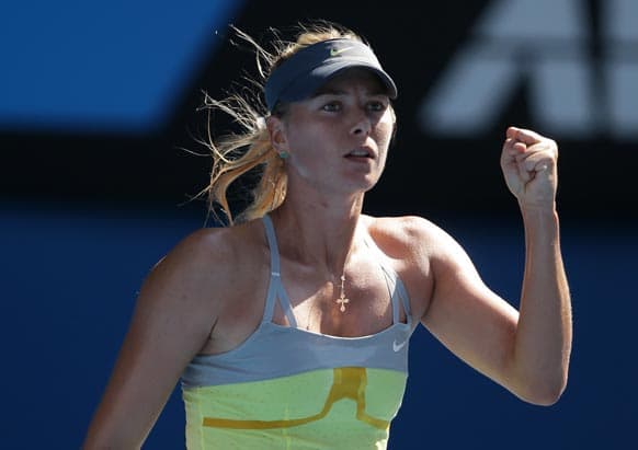 Russia`s Maria Sharapova celebrates after defeating Belgium`s Kirsten Flipkens in their fourth round match at the Australian Open tennis championship in Melbourne.