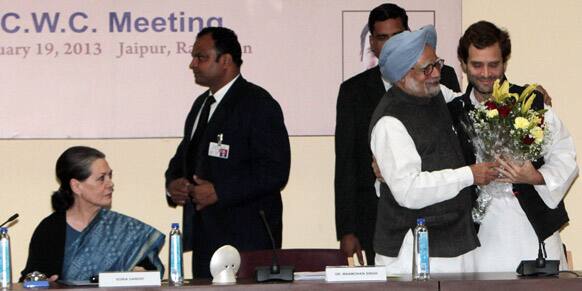 Indian Prime Minister Manmohan Singh, second right, greets Rahul Gandhi after he was appointed Vice President of the Congress party, as party President Sonia Gandhi watches in Jaipur.