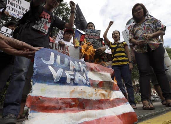 Protesters burn a mock American flag during a rally at the US Embassy in Manila to protest the recent incident in the Philippines wherein a US Navy minesweeper, USS Guardian, ran aground off Tubbataha Reef, a World Heritage Site in the Sulu Sea Manila.
