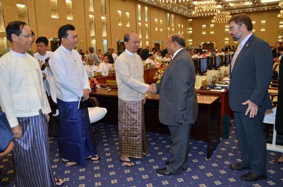 Myanmar president Thein Sein, greets guests during the 1st Myanmar Development Cooperation Forum in Naypyitaw, Myanmar.