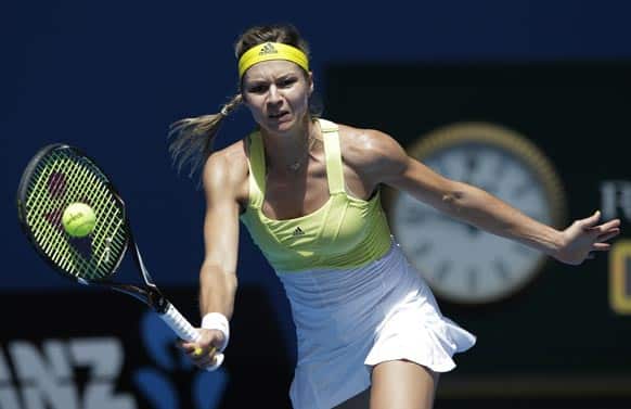 Russia`s Maria Kirilenko hits a forehand return to Belgium`s Yanina Wickmayer during their third round match at the Australian Open tennis championship in Melbourne.