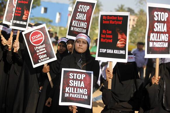 Shiite Muslim women hold placards as they protest against the killings of Shiite Muslims in deadly bombings last week in Quetta, Pakistan, during a protest rally in Bangalore.