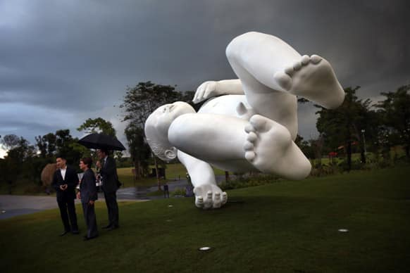 A giant sculpture of a baby titled
