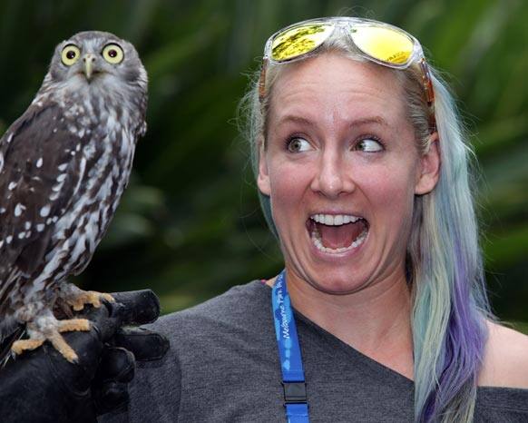This photo released by Tennis Australia Bethanie Mattek Sands of the US reacts as she has a owl placed on her shoulder in the players lounge at the Australian Open tennis championship in Melbourne, Australia.