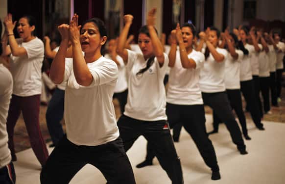 Female staff members of a luxury hotel exhibit their skills after a 10-day self-defense course initiated by the hotel management and Delhi Police women’s wing in New Delhi.