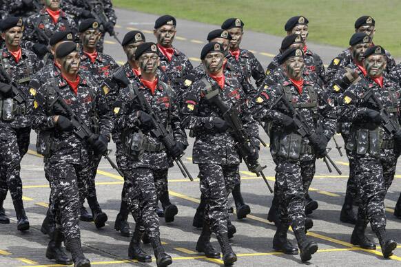 Philippine army`s Scout Rangers march during a testimonial review in honor of outgoing Armed Forces Chief Gen. Jesse Dellosa and to welcome its new Chief-of-Staff Gen. Emmanuel Bautista at the change-of-command ceremony at Camp Aguinaldo in suburban Quezon city, northeast of Manila.