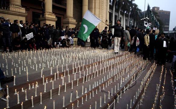 People gather outside the Provincial assembly during a pro-democracy protest in Lahore, Pakistan.