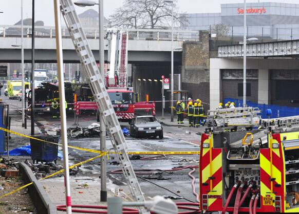 Debris lies on the ground after a helicopter crashed into a construction crane on top of St George`s Wharf tower building, in London.
