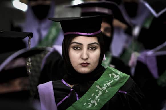 An Afghan midwife attends her graduation ceremony at the governor`s house, in Jalalabad east of Kabul. Over 52, midwives graduated after receiving 2 year of training in Jalalabad.