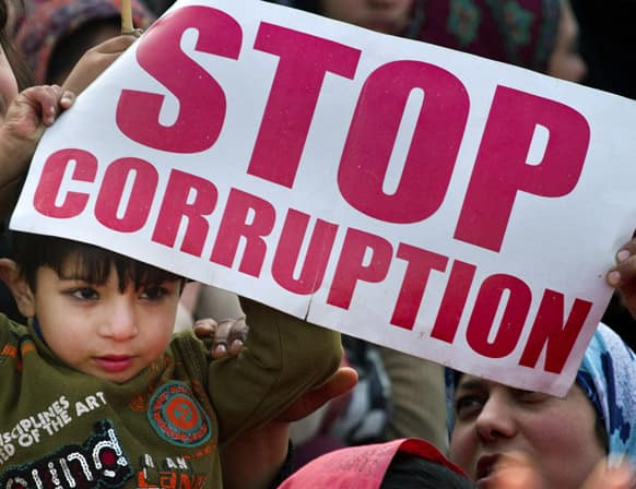 A Pakistani boy holds a placard during an anti-government rally called by Sunni Muslim cleric Tahir-ul-Qadri in Islamabad.