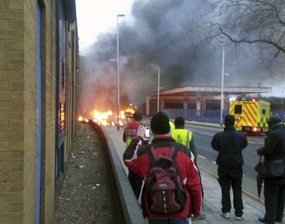 A general view of the scene shortly after a helicopter crashed in the Vauxhall area of central London, after hitting a crane on top of a tower block by the River Thames, according to eye witness reports.
