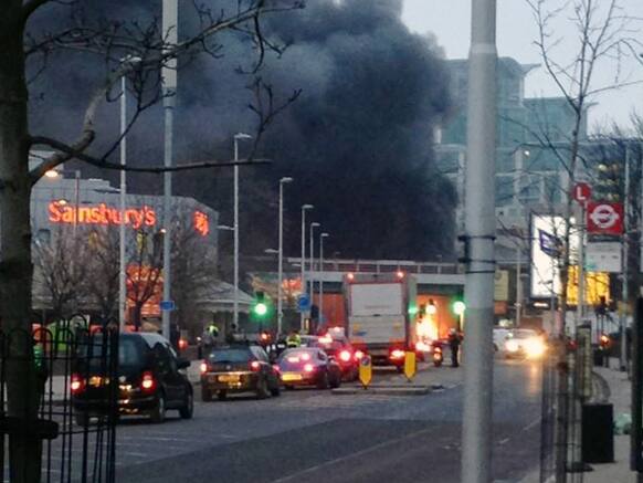 Smoke billows from the scene following a helicopter crash in central London, after it hit a crane on St. George`s Tower building in the Vauxhall area of central London.