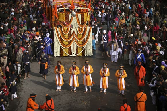 Sikh devotees take out a procession to celebrate the birth anniversary of Guru Gobind Singh in Jammu. The birth anniversary of Guru Gobind Singh, the tenth Sikh guru, will be marked on Jan 18.