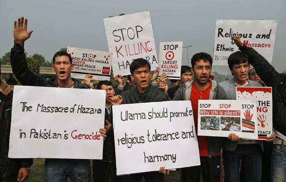 Hazara Shiite Muslims residing in India shout slogans during a protest against alleged target killing of Hazara community members in Pakistan, outside the Pakistani embassy in New Delhi.