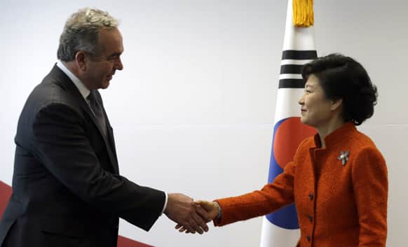 South Korean President-elect Park Geun-hye, right, shakes hands with US Assistant Secretary of State Kurt Campbell before their meeting at Park`s office in Seoul, South Korea.