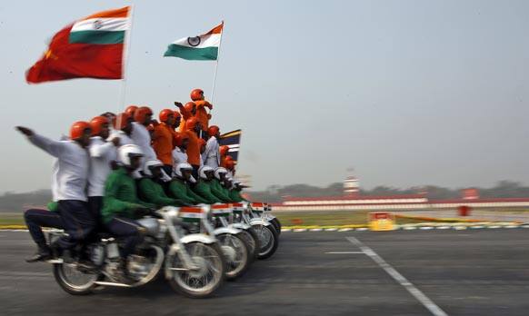 Indian army soldiers display stunts on motorbikes during a parade to mark Indian Army Day, an annual event honoring the military, in New Delhi.