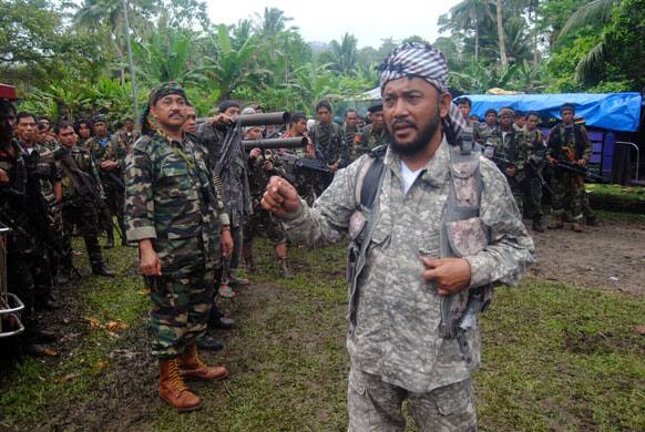 Khabir Malik, Commander of the Moro Islamic Liberation Front, a Muslim rebel group which signed a 1996 peace pact with the Philippine Government briefs his comrades at Patikul township, on the volatile island of Jolo in southern Philippines.