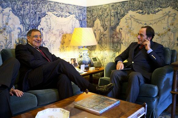 US Defense Secretary Leon Panetta, left, meets with Portugal`s Foreign Minister Paulo Portas at the Ministry of Foreign Affairs in Lisbon, Portugal