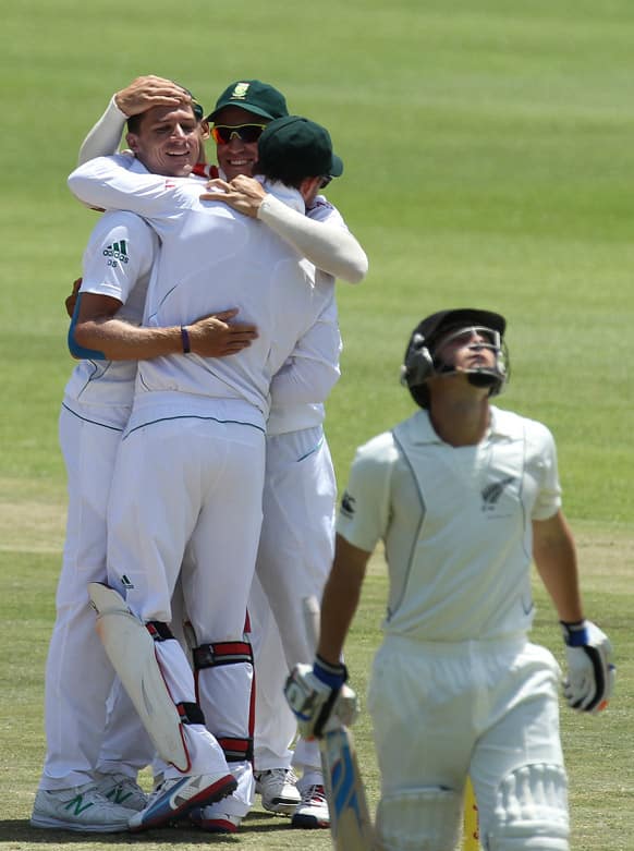 Dale Steyn celebrates with teammates after bowling New Zealand`s batsman BJ Watling on day four of their second cricket test match at the St Georges Stadium in Port Elizabeth, South Africa.