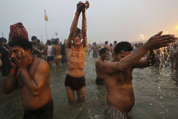 Hindu perform prayer rituals at Sangam, the confluence of the rivers Ganges, Yamuna and mythical Saraswati, during the royal bath on Makar Sankranti at the start of the Maha Kumbh Mela in Allahabad.