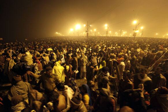 Thousands of Hindu devotees gather at Sangam, the confluence of the Ganges, Yamuna and mythical Saraswati river on Makar Sankranti, the first day of the Maha Kumbh Mela, in Allahabad.