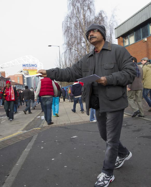 Santanu Pal, father of missing Indian student Souvik Pal hands out leaflets before Manchester United`s English Premier League soccer match against Liverpool at Old Trafford Stadium, Manchester, England.