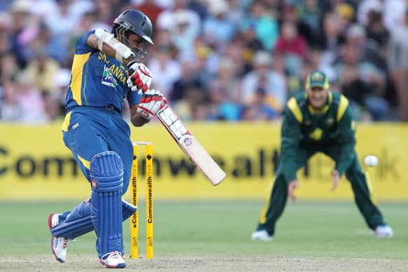 Sri Lanka`s Lahiru Thirimanne, left, drives the ball against Australia during their One Day International cricket match in Adelaide.