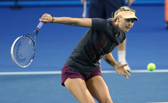 Russia`s Maria Sharapova makes a backhand return during a practice session ahead of the Australian Open tennis championship in Melbourne, Australia.